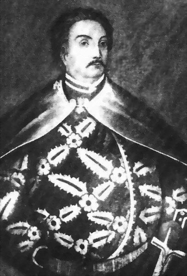 Schwarzes und weißes Foto von Papst Johannes Paul II. in Priesterroben, trägt eine schwarze Robe mit weißem Kragen und Manschetten, Hände gefaltet, strenger Ausdruck, direkter Blick.