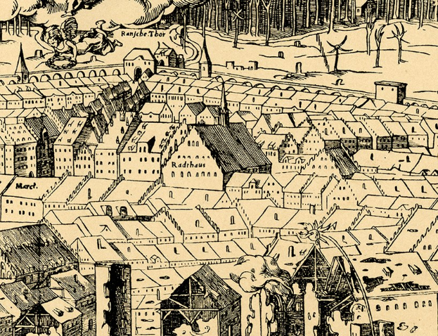 Ein detailliertes Stadtbild mit zahlreichen Gebäuden, Bäumen im Hintergrund und Rauch, der aus den Gebäuden aufsteigt.
