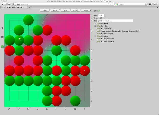 Ein Computermonitor zeigt ein Go-Spiel mit roten und grünen Kreisen in einem Gittermuster.